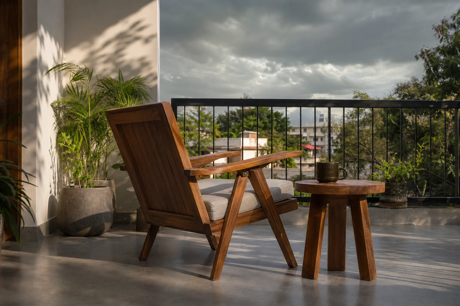 How to Maintain Teak Wood Furniture at Home? 3 Teak outdoor furniture on a covered balcony or patio, partially shaded from direct sunlight, showing weather protection. photorealistic image of solid teak wood outdoor furniture, a lounge chair and small side table, positioned on a shaded