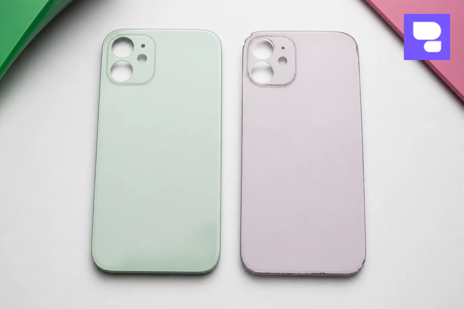 Side-by-side comparison of a genuine-quality replacement back glass part versus a lower quality aftermarket part. Photorealistic macro photograph showing two iPhone back glass replacement parts side by side on a white surface, one with