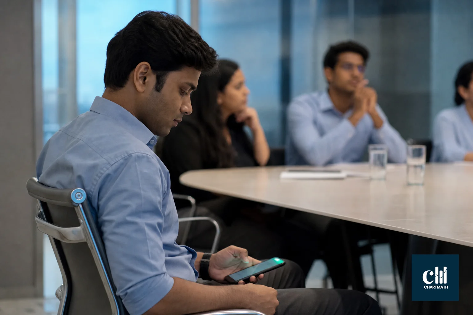 A salaried Indian professional in a meeting glancing at a phone buzzing with a notification. photorealistic photo of a young Indian professional in business casual attire sitting at a conference table during an office meeting, glancing