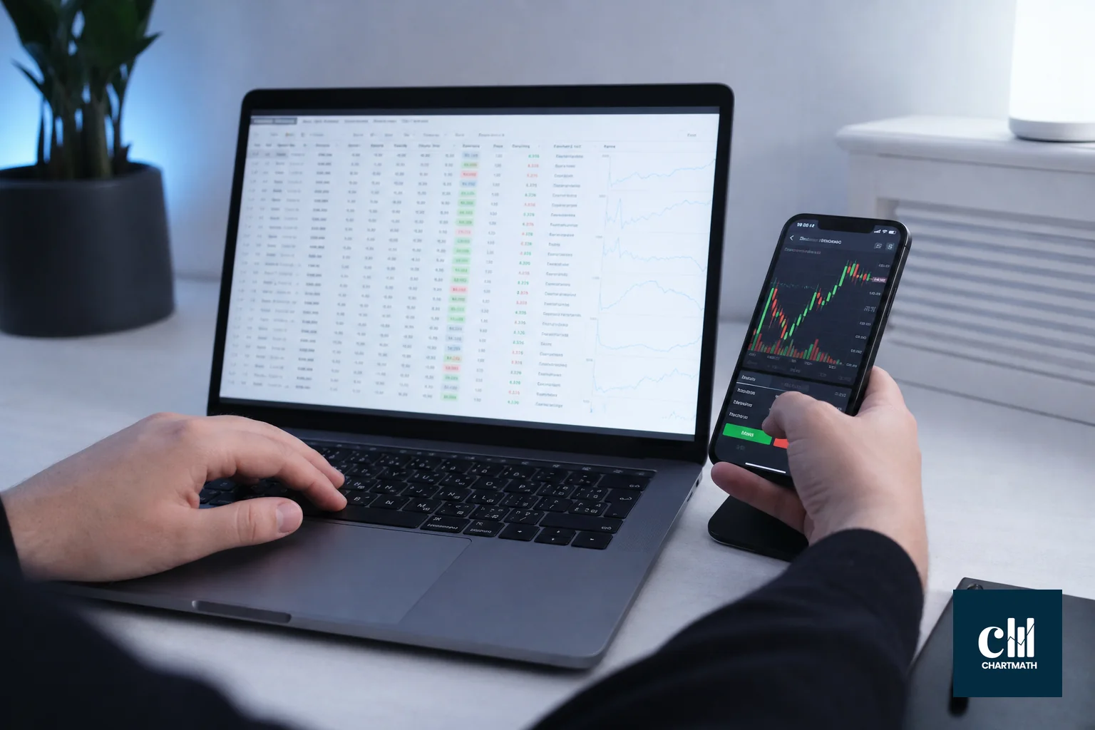 Split workflow of switching between two separate trading apps. photorealistic: a desk setup with two separate devices, a laptop showing a stock screener spreadsheet-style interface on the left and a phone showing a different broker