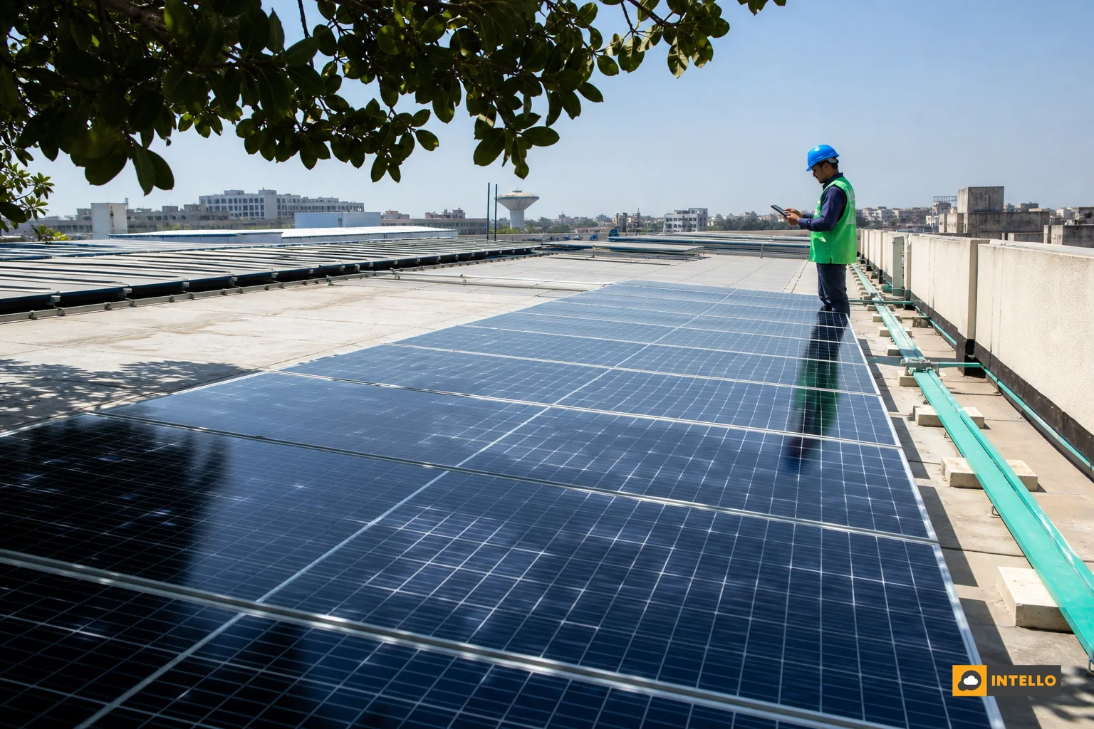 Rooftop solar array partially shaded by a tree, showing the diagnostic challenge of shading loss. Photorealistic photo: an Indian commercial rooftop solar installation in daylight, one row of panels cast in partial shadow from an