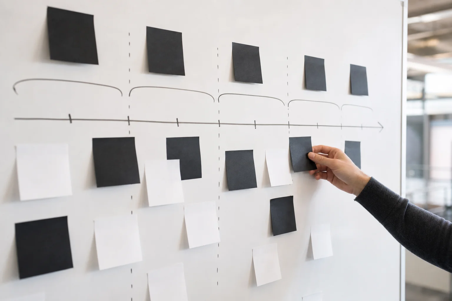 Whiteboard planning session mapping out a fintech MVP development timeline with sticky notes and sprint phases. Photorealistic photo of a project planning whiteboard covered in sticky notes and a hand-drawn timeline representing sprint