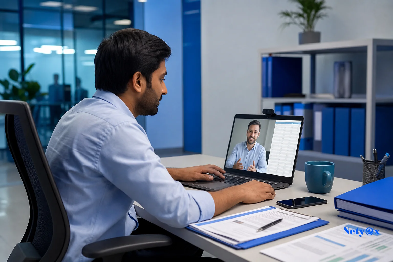 A sourcing specialist coordinating shipment paperwork with a freight forwarder over a video call and laptop. photorealistic: A professional sourcing specialist in a modern office in India reviewing export documents on a laptop screen while