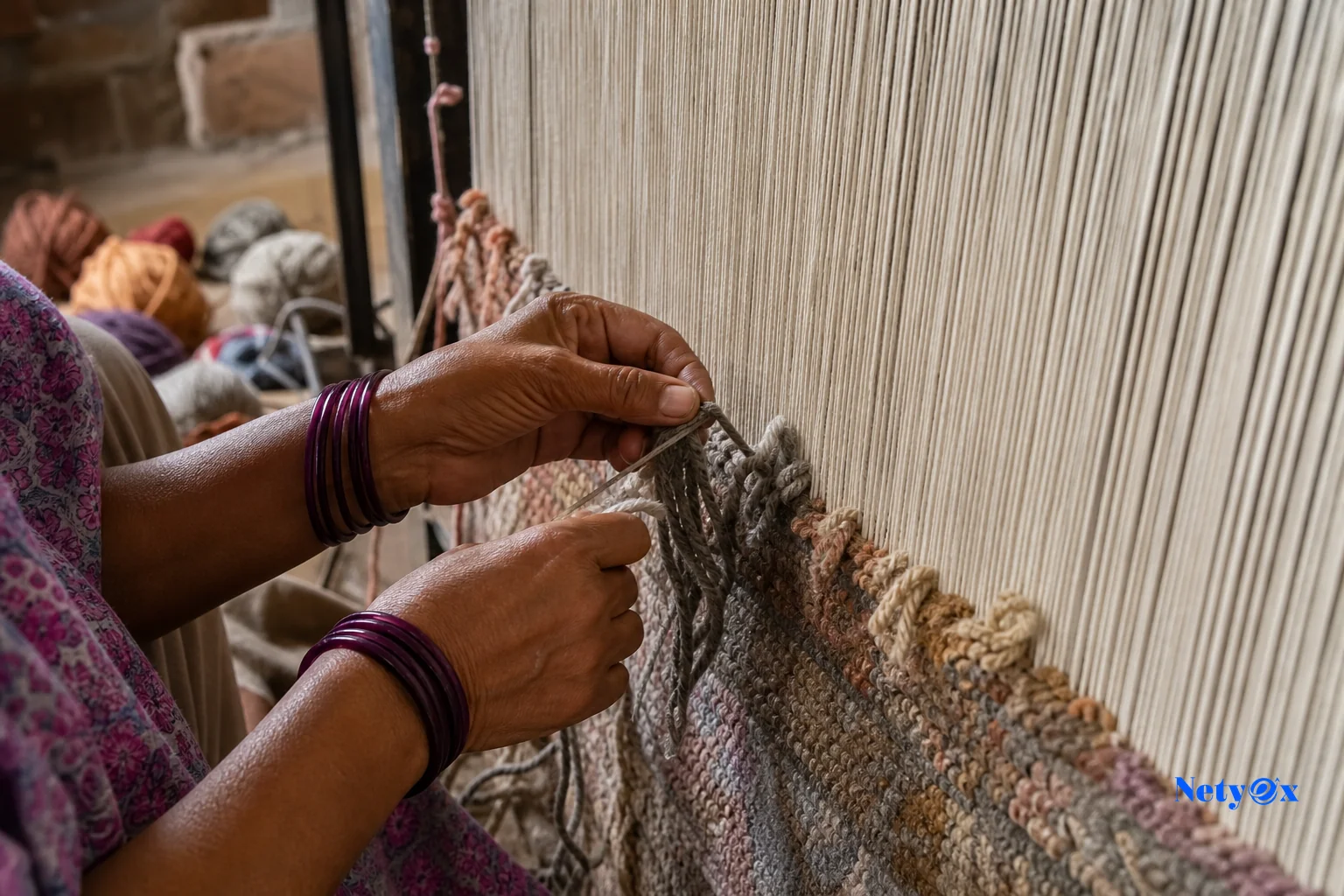 Close-up of hand-knotting wool rug in an Indian workshop showing fibre and craftsmanship. photorealistic photo of an artisan's hands hand-knotting wool yarn onto a rug loom in an Indian workshop, close-up on wool fibres and knots, warm