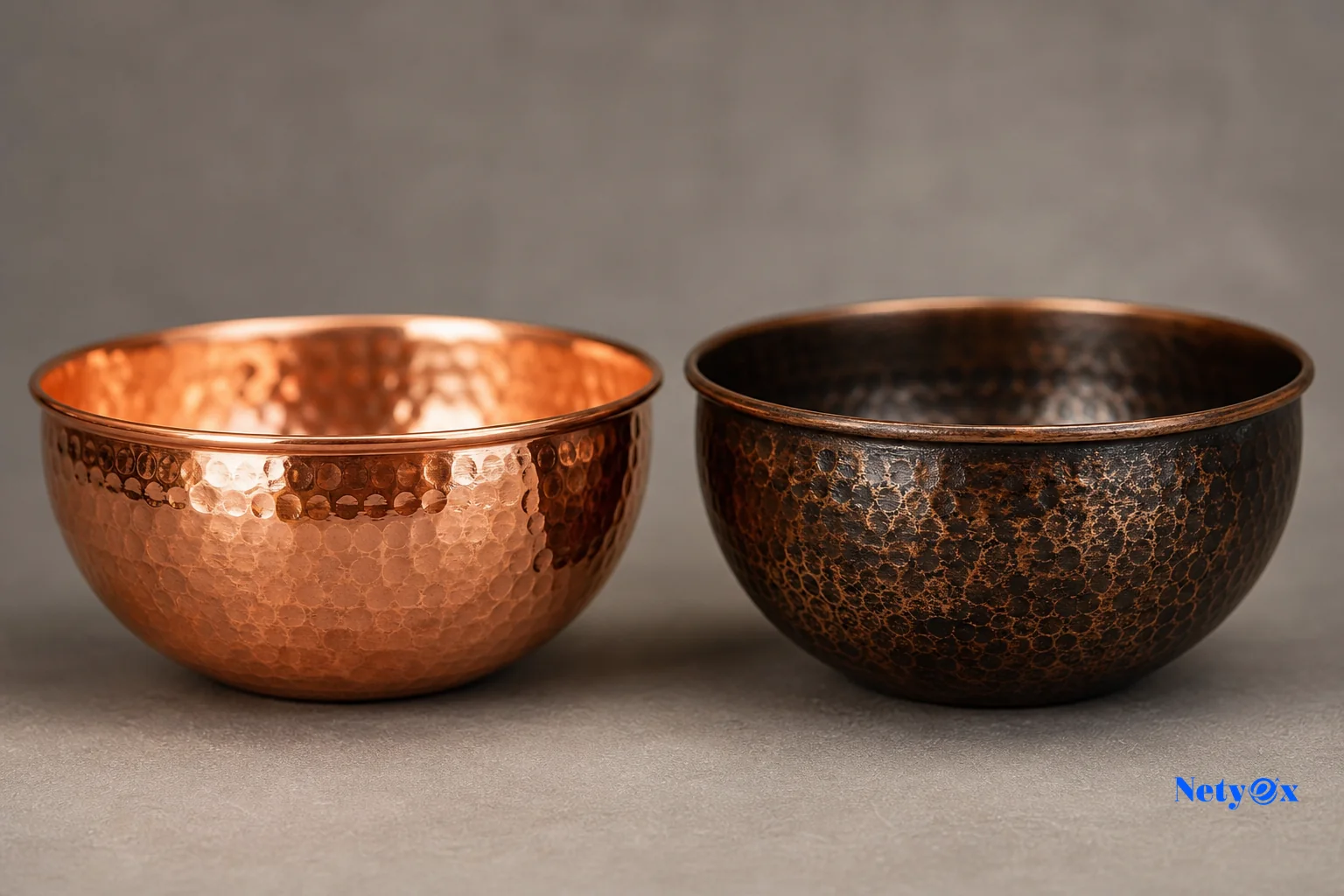 Two hand-hammered copper decorative bowls side by side showing different finish and patina
